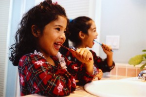 Sisters Brushing Teeth